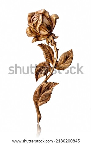 Bronze rose. Shiny metallic rose flower isolated on white background. Yellow metal decorative item.