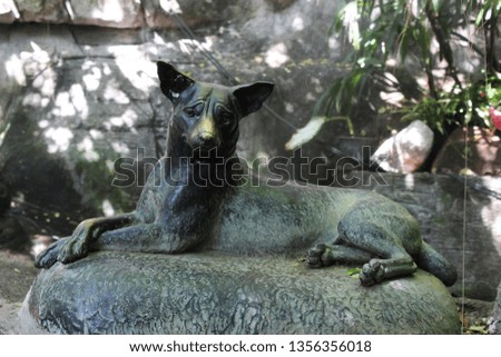 Bronze sculpture of a dog
