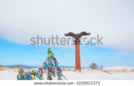 Bronze sculpture of an eagle in the Tazheranskaya steppe. The shaman eagle column nearthe lake Baikal