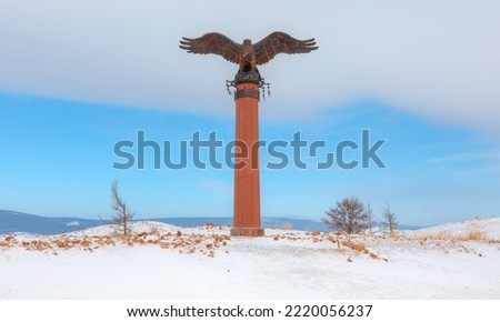 Bronze sculpture of an eagle in the Tazheranskaya steppe. The shaman eagle column nearthe lake Baikal