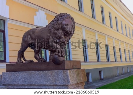 bronze sculpture of a formidable lion. The concept of strength, power
