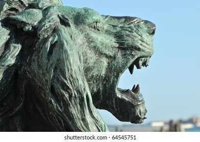 bronze sculpture of a lion roaring