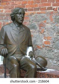 bronze sculpture of a writer Oscar Wilde. Location - Tartu, city in Estonia