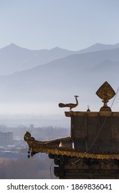 Bronze sculptures on the top of   temple's roof in Tibet