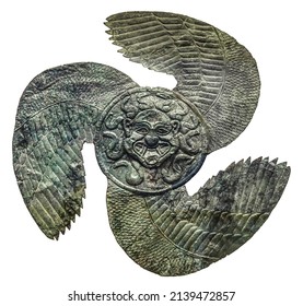 Bronze shield blazon from Ancient Olympia Greece featuring a Gorgoneion - head of a Gorgon - in the center with wings around dated to the first half of the sixth century BC