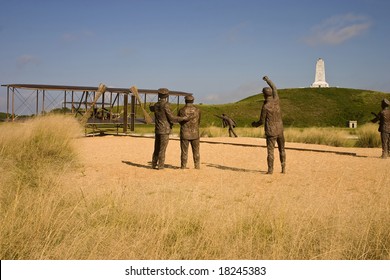 A Bronze Statue Commemorating The First Powered Airplane Flight By The Wright Brothers