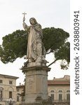 Bronze statue of Girolamo Savonarola by Enrico Pazzi in Piazza Savonarola, Florence, showing the friar in a dramatic pose.