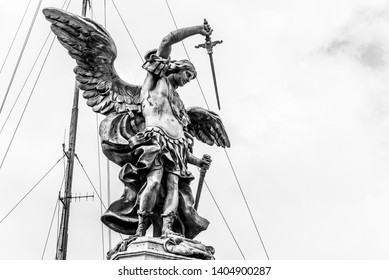 Bronze statue of Michael the Archangel on the top of the Castel Sant'Angelo, Rome, Italy. Black and white image.