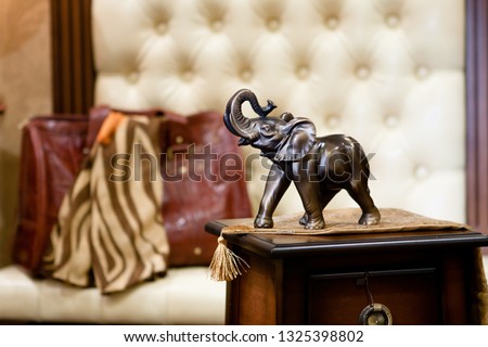 bronze statuette of an elephant in a classic interior