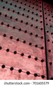 bronze surface with rivets