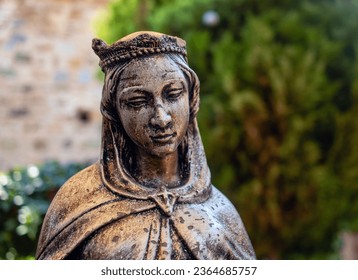 Bronze Virgin Mary statue, close-up.