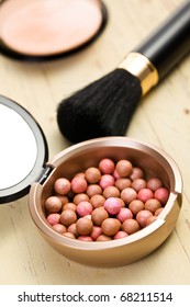 the bronzing pearls and makeup brush