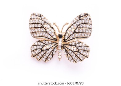 Brooch golden butterfly with diamonds isolated on white