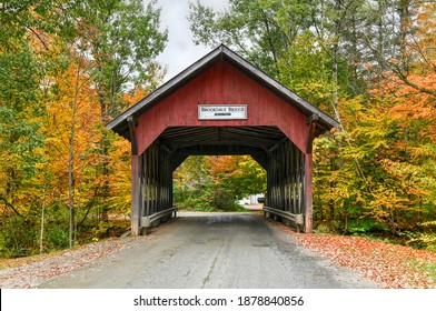 Brookdale Covered Bridge in Stowe, Vermont during fall foliage over the West Branch Little River.