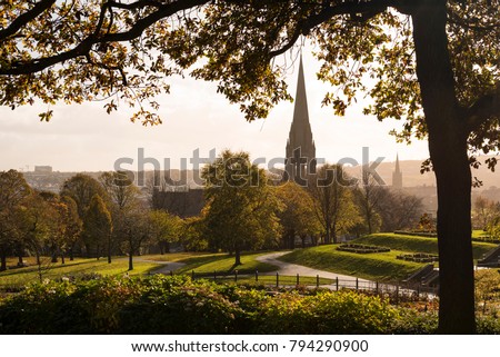 Brooke Park, Derry, Northern Ireland capturing autumn scene of rustic colours with a view of the city’s cathedral in the background. 