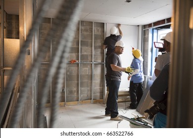 Brooklyn Borough Hall senior staff help Habitat for Humanity New York City on a home building construction project in Brownsville section of Brooklyn during Fleet Week New York, NEW YORK MAY 25 2017.