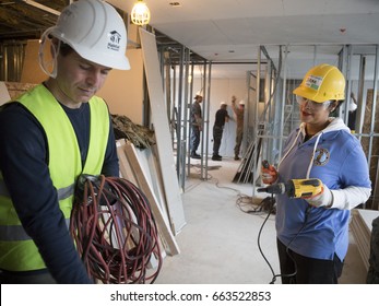 Brooklyn Borough Hall Senior Staff Help Habitat For Humanity New York City On A Home Building Construction Project In Brownsville Section Of Brooklyn During Fleet Week New York, NEW YORK MAY 25 2017.