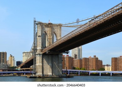 Brooklyn Bridge (1883), hybrid cable-stayed, suspension bridge, against blue skyin New York City. United States