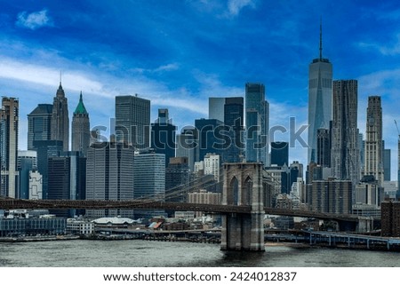 Brooklyn Bridge with the blue sky linking the boroughs of Manhattan and Brooklyn in New York (USA) this bridge is one of the most famous and well known in the Big Apple.