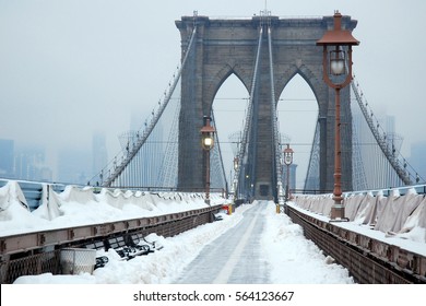 The Brooklyn Bridge is covered under a blanket of snow on a Winter's day - Powered by Shutterstock