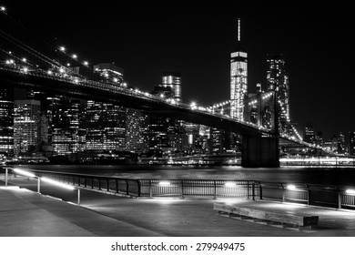 Brooklyn Bridge, Downtown Manhattan, New York. Night Scene. Light Trails. City Lights. Urban Living And Transportation Concept. Monochrome, Black And White Post Processed