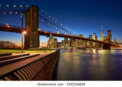 Brooklyn Bridge in evening with the skyscrapers of Lower Manhattan, East River. Brooklyn Bridge Park, New York City, USA