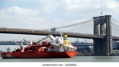 Brooklyn bridge and freighter