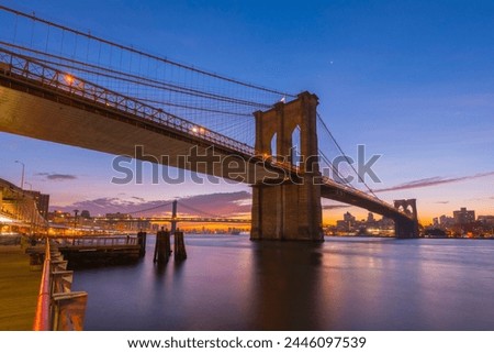 Similar – Image, Stock Photo Brooklyn Bridge over river against city in evening