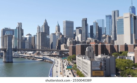 Brooklyn Bridge from Manhattan Bridge. New York City downtown skyline, financial district cityscape, World Trade Center. Transport traffic on FDR Drive highway by East River water, United States. - Powered by Shutterstock