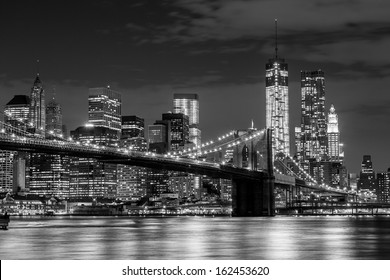 Brooklyn Bridge and Manhattan skyline at night in black and white - Powered by Shutterstock