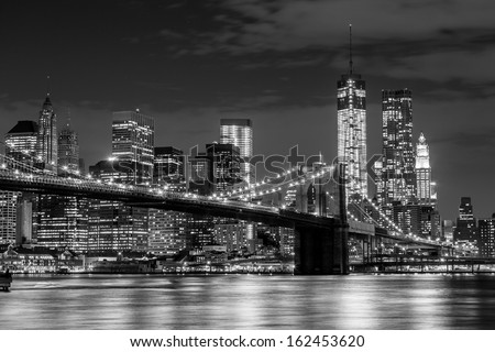 Brooklyn Bridge and Manhattan skyline at night in black and white