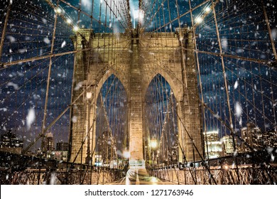 Brooklyn Bridge New York City with snowflakes falling during winter snow storm - Powered by Shutterstock