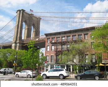 Brooklyn Bridge In New York City View From Residential Brooklyn Heights Luxury Neighborhood Area With Apartment Building And Cars Parked In Front. New Yorker Lifestyle Travel Tourism USA Life Concept