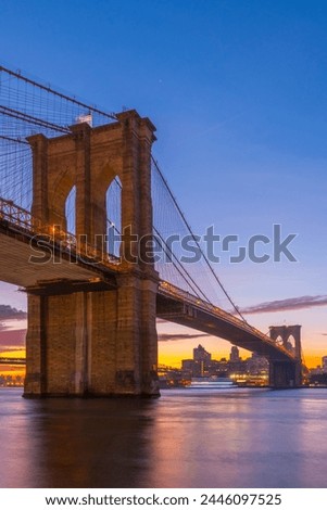 Similar – Image, Stock Photo Brooklyn Bridge over river against city in evening