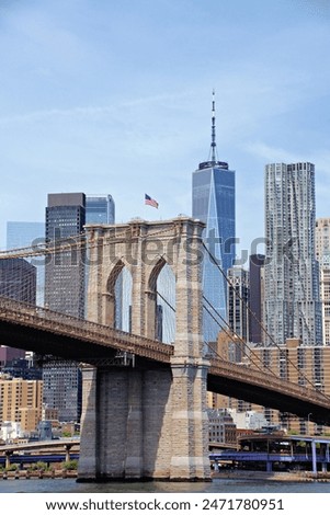 Similar – Image, Stock Photo Brooklyn Bridge over river against city in evening