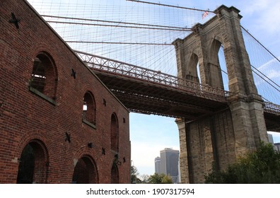 Brooklyn Bridge Passing Above A Brick Building