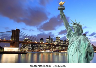 Brooklyn Bridge and The Statue of Liberty at Night, New York City - Shutterstock ID 128395307