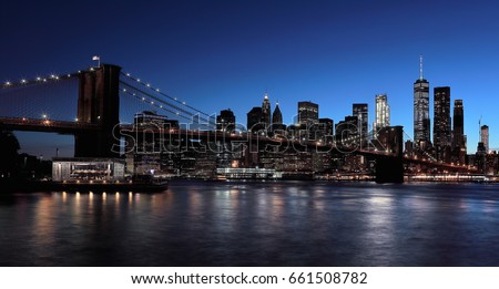 The Brooklyn Bridge, which is deepening by night.