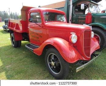 Brooklyn, Connecticut / USA - June 24 2018: An Antique Red Ford Pick Up Truck Next To A Green 1938 Mack FJ At Brooklyn Fairgrounds For The ATHS Nutmeg Chapter Truck Show