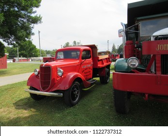 Brooklyn, Connecticut / USA - June 24 2018: An Antique Red Ford Pick Up Truck Next To A Green 1938 Mack FJ At Brooklyn Fairgrounds For The ATHS Nutmeg Chapter Truck Show