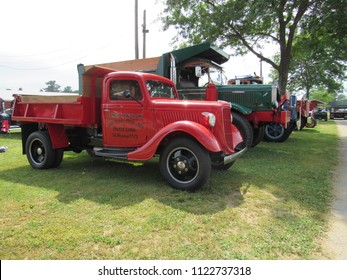 Brooklyn, Connecticut / USA - June 24 2018: An Antique Red Ford Pick Up Truck Next To A Green 1938 Mack FJ At Brooklyn Fairgrounds For The ATHS Nutmeg Chapter Truck Show