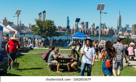 Brooklyn,, New York - 23rd September, 2017: People enjoying the outdoor food market at Smorgasburg in Williamsburg, New York. The market takes place on Saturdays in East river park