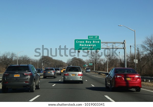 BROOKLYN, NEW YORK - JANUARY 14, 2018: Belt\
Parkway in Brooklyn.The Belt System is a series of connected\
highways that form a belt-like circle around the New York City\
boroughs of Brooklyn and\
Queens