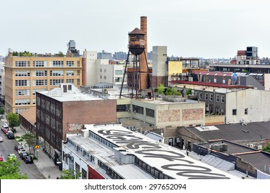 Brooklyn, New York - July 12, 2015: Graffiti covered buildings in  Williamsburg, Brooklyn. Williamsburg has become known as an arts and culture mecca in New York city.