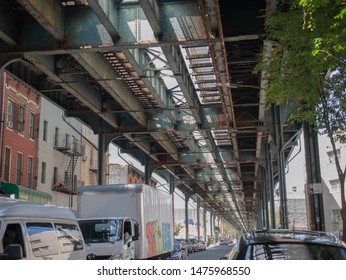 Brooklyn, New York - July 2019: A Picture Of A Subway Platform Above The Streets Of Bushwick. 