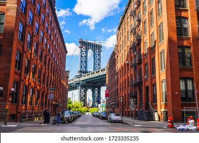 BROOKLYN, NEW YORK - MAY 4, 2020: Iconic Manhattan Bridge And Empire State Building View From Washington Street In Brooklyn, New York