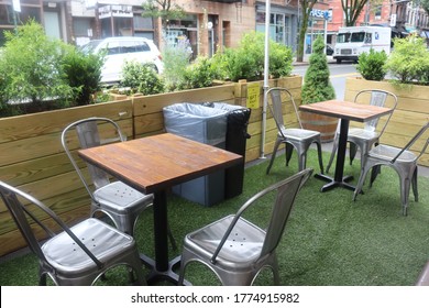 Brooklyn, New York / United States - July 11 2020: Restaurant outdoor seating on city street during Coronavirus pandemic shutdown