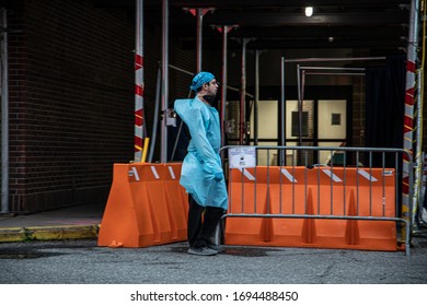 BROOKLYN, NEW YORK , USA - April 03, 2020: Exhausted Medical Worker Walking Past Firefighters And Staff With The FDNY Cheering On And Supporting Health Care Workers For All Their Hard Work