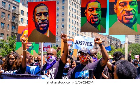 Brooklyn, New York / USA - June 19, 2020: Marchers Raise Their Fists At A Justice Rally For George Floyd And Celebration Of Juneteenth