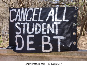 BROOKLYN, N.Y. – April 3, 2021: A protest banner is seen near Grand Army Plaza during a rally to cancel student loan debts.
